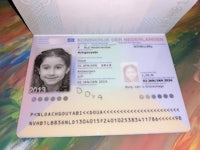 a picture of a child's passport on a colorful background
