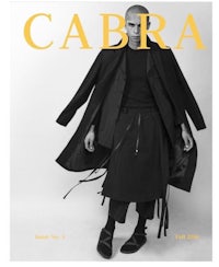 the cover of cabra magazine with a man in a coat