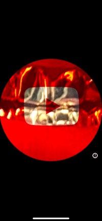 a red circle with a youtube logo on it