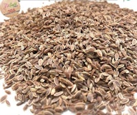 a pile of fenugreek seeds on a white background