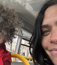 a woman and a child on a bus with curly hair