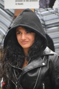 a woman wearing a black leather jacket