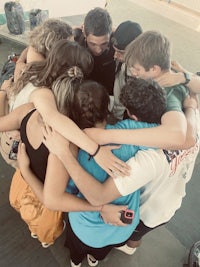 a group of people in a huddle