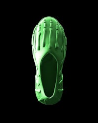 a green shoe with a skeleton on it