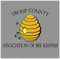 the logo for the troup county association of bee keepers