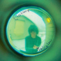 a person's reflection in a glass ball with the word closure written on it