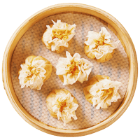 chinese steamed dumplings in a bamboo basket