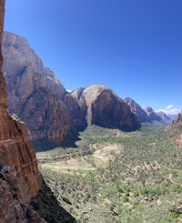 a view of a canyon from an arch in zion national park