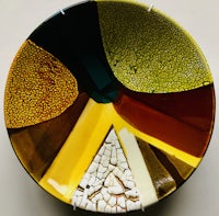 a yellow, brown, and black plate