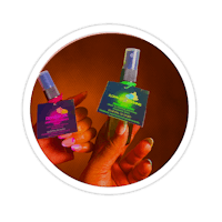 two hands holding a bottle of glow in the dark spray