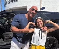 dwayne 'the rock' johnson and his daughter pose for a photo