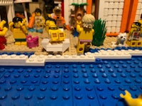 a group of lego people on a beach
