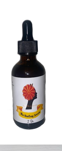 a bottle of the healing oil on a white background