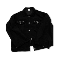 a black denim jacket with studded details