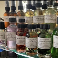 a display of various oils on a shelf