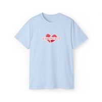 a light blue t - shirt with a heart on it