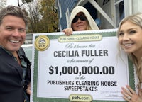 two women holding a sign that says cecilia fuller's publisher's cleaning sweepstakes house