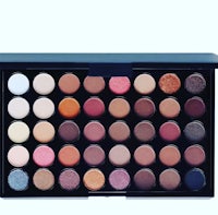 an eyeshadow palette in a box on a white background