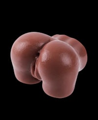 a brown toy butt on a black background