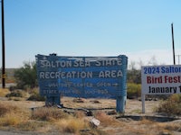 a blue sign that says salt lake state recreation area