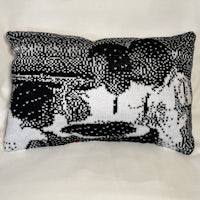 a black and white pillow with a black and white pattern