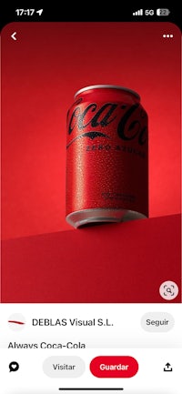 a coca cola can on a red background