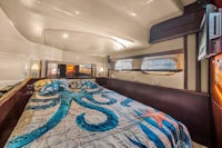 a bed in a boat with an octopus on it