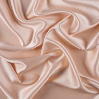 a close up image of a pink satin fabric