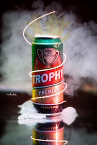 a can of beer with smoke coming out of it