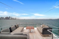 the deck of a yacht with a view of the ocean