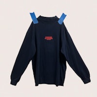a black long sleeved shirt with a red and blue tape on it
