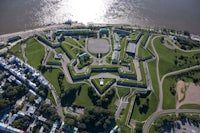 an aerial view of a fort near the water
