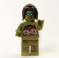 a lego figure with a zombie head on it