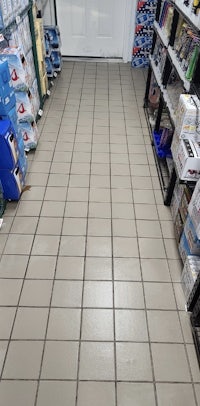 a tiled floor in a store with a lot of products