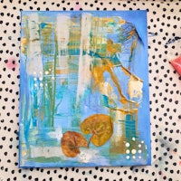 a blue and yellow painting on a polka dot background