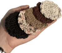 a person holding a set of crocheted coasters