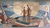 a mural depicting a woman and a man in the middle of a field