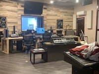 a recording studio with a lot of equipment
