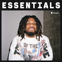 a man with dreadlocks wearing a sweatshirt with the words essentials
