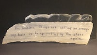 a piece of glass with a quote on it