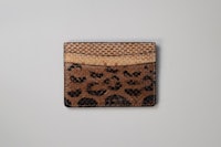 an animal print card holder on a white background