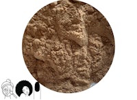 a brown powder with an image of a woman's face