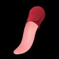 a red sex toy on a black background