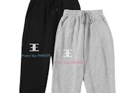 two pairs of sweatpants with the word e on them