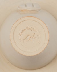 a white bowl with a logo on it