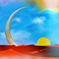 a crescent moon and sun in the desert