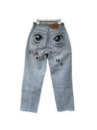 a pair of jeans with eyes on them