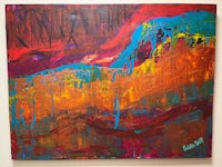 an abstract painting with red, orange, and blue colors