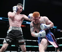 two boxers in action in a boxing ring
