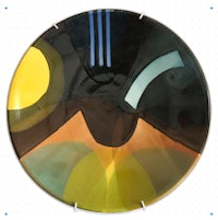 a plate with a black, yellow, and orange design